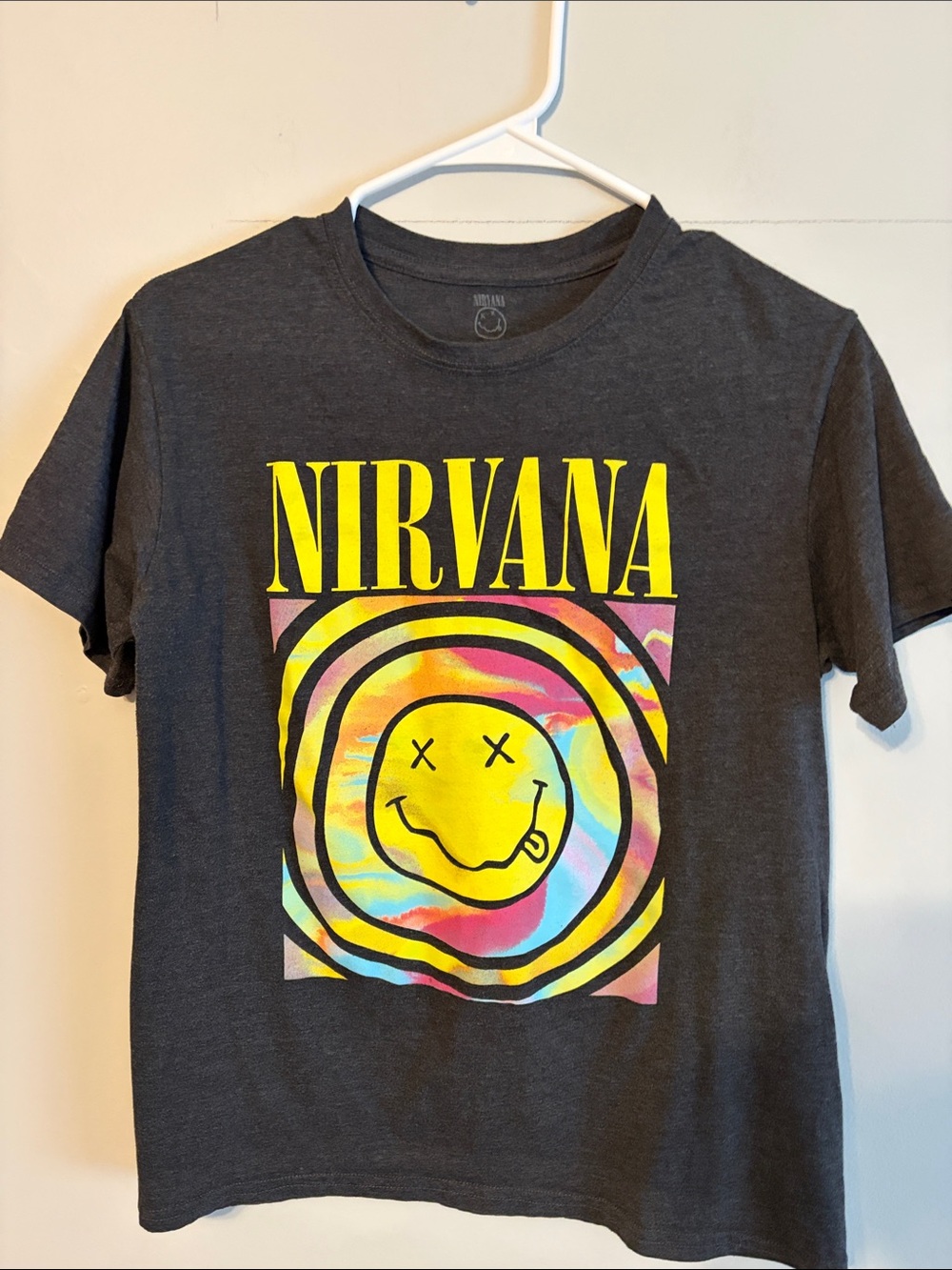 NIRVANA Charcoal Tee with Bright Yellow Smiley and Multicolor Swirl. Small.
